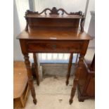 A VICTORIAN MAHOGANY TALL RECEPTION SIDE TABLE WITH SHELF TO THE BACK AND CARVED TOP RAIL, ON TURNED