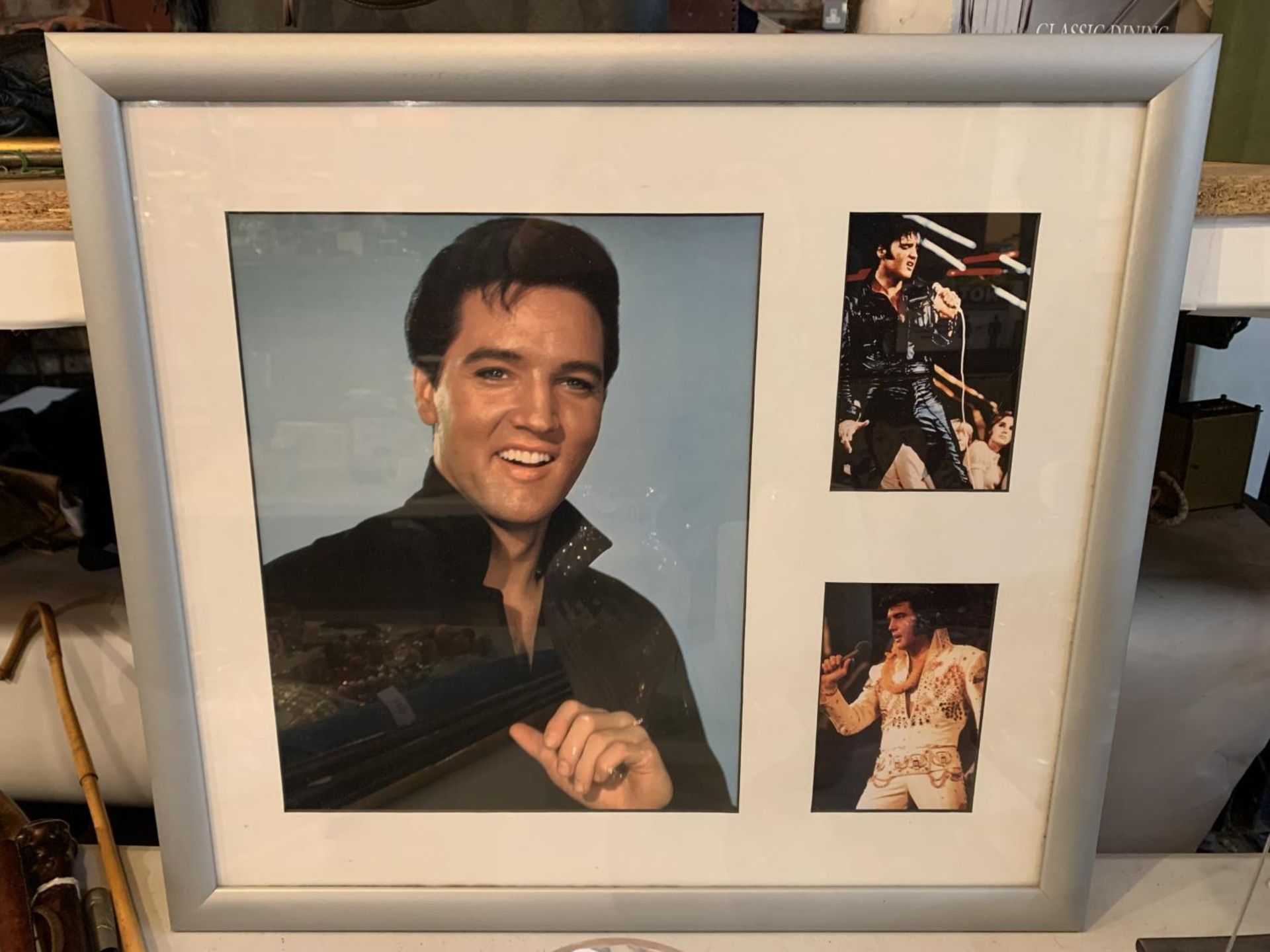 A FRAMED AND MOUNTED MONTAGE OF ELVIS