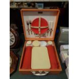 A VINTAGE PICNIC SET IN A WOODEN BOX