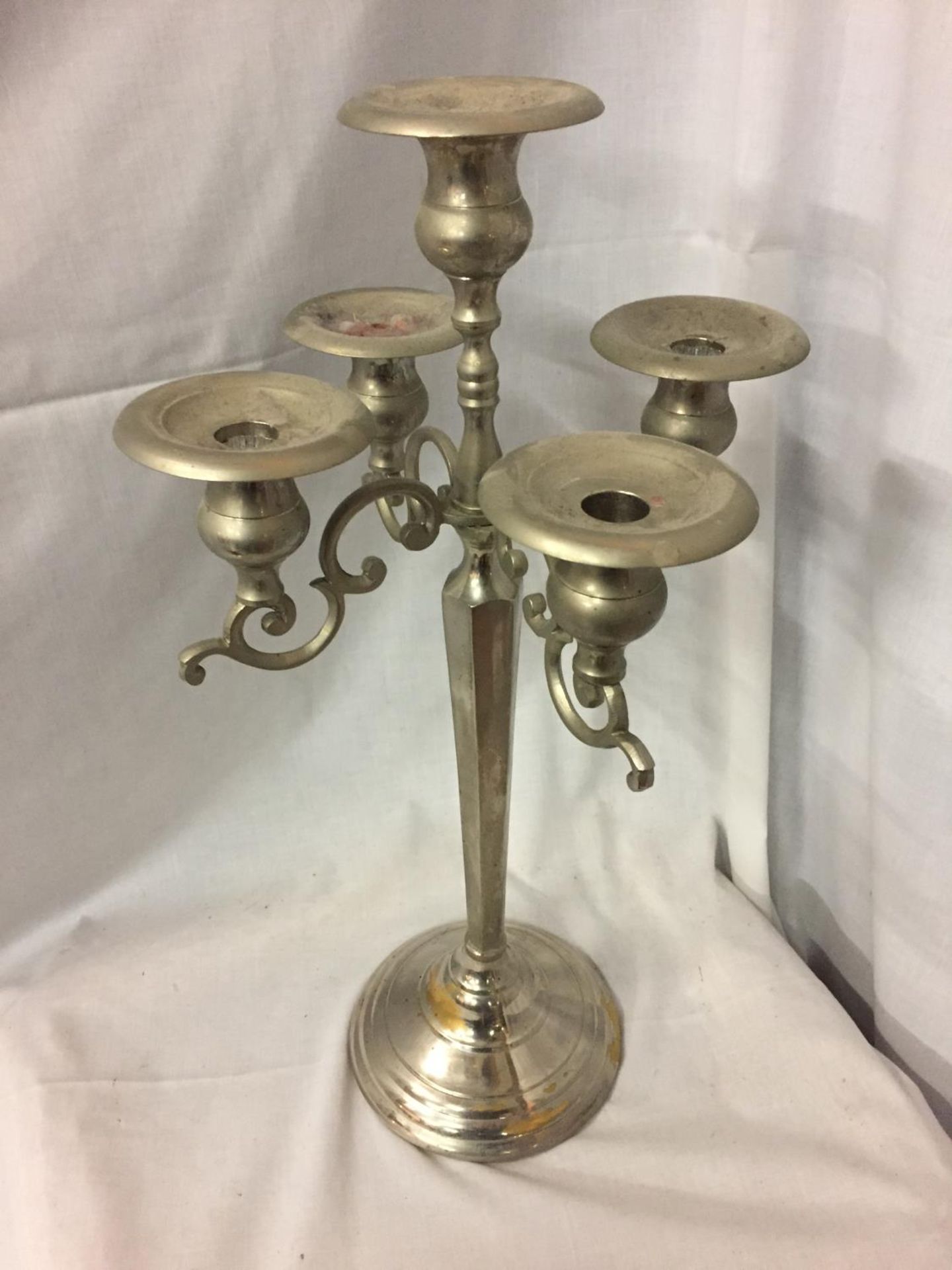 A TALL ORNATE CHROME FIVE BRANCH CANDLEABRA