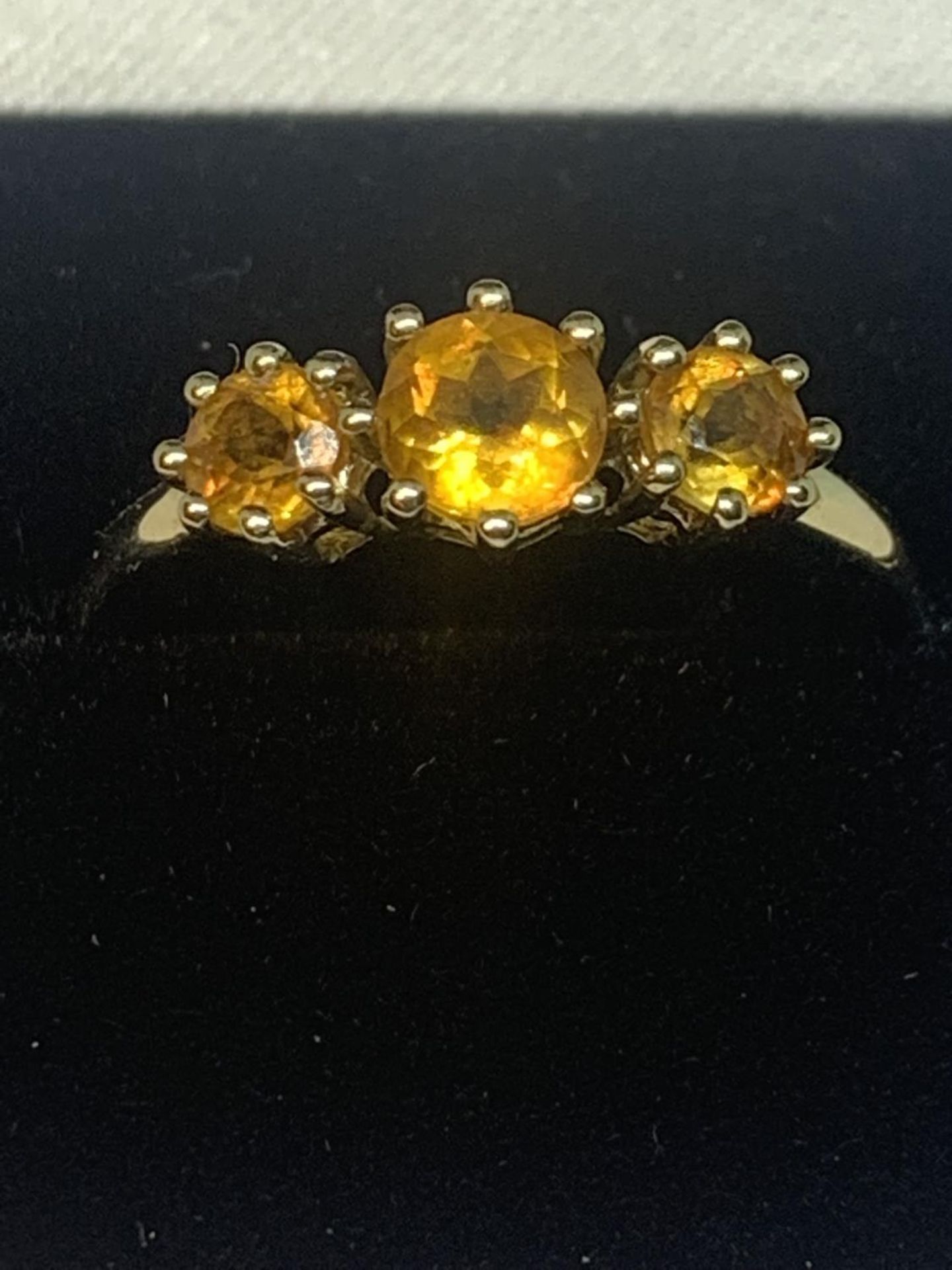 A 9 CARAT GOLD RING WITH THREE IN LINE CITRINES SIZE R IN A PRESENTATION BOX