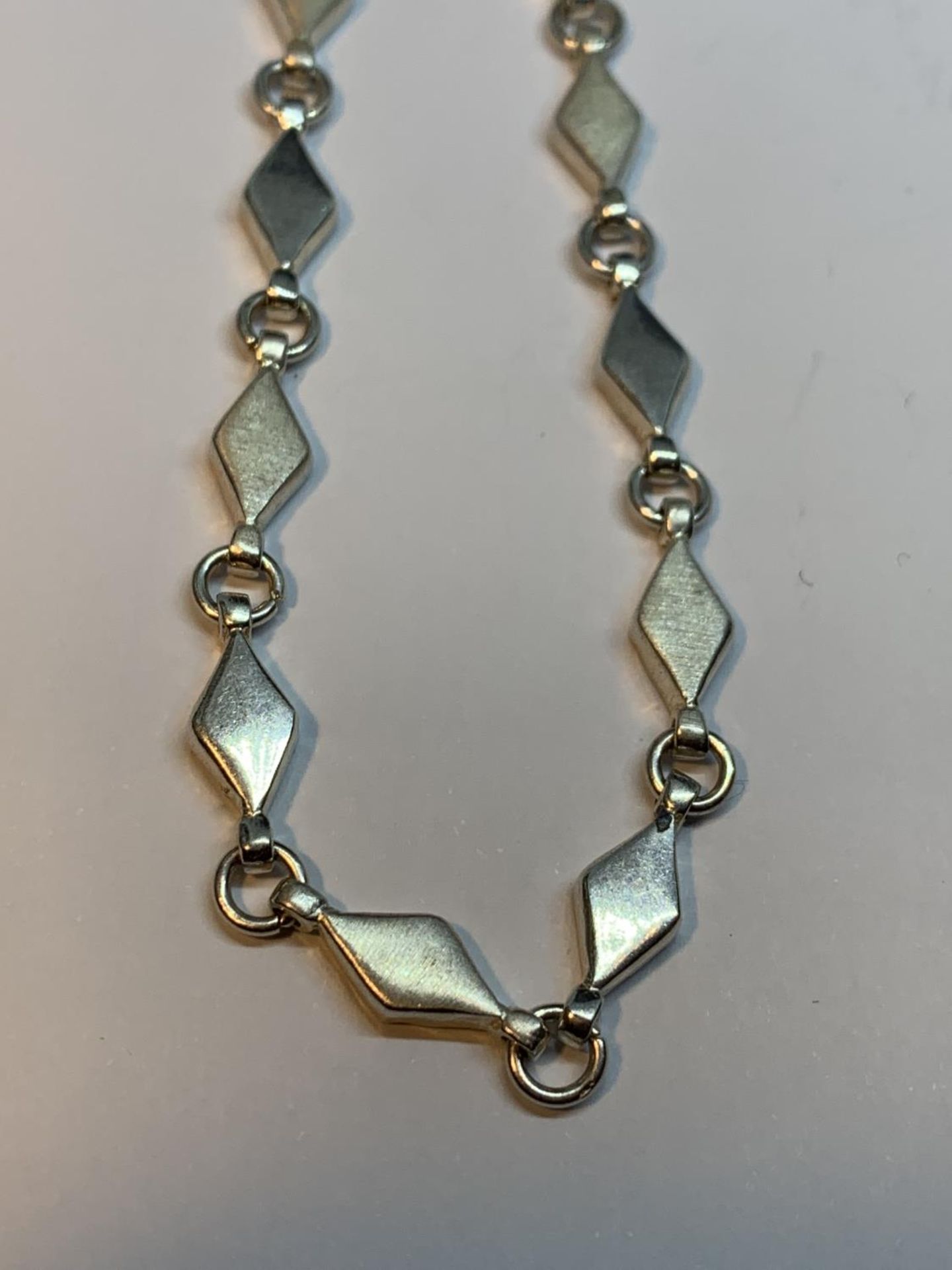 FOUR SILVER BRACLETS TO INCLUDE A DOLPHIN DESIGN - Image 5 of 5