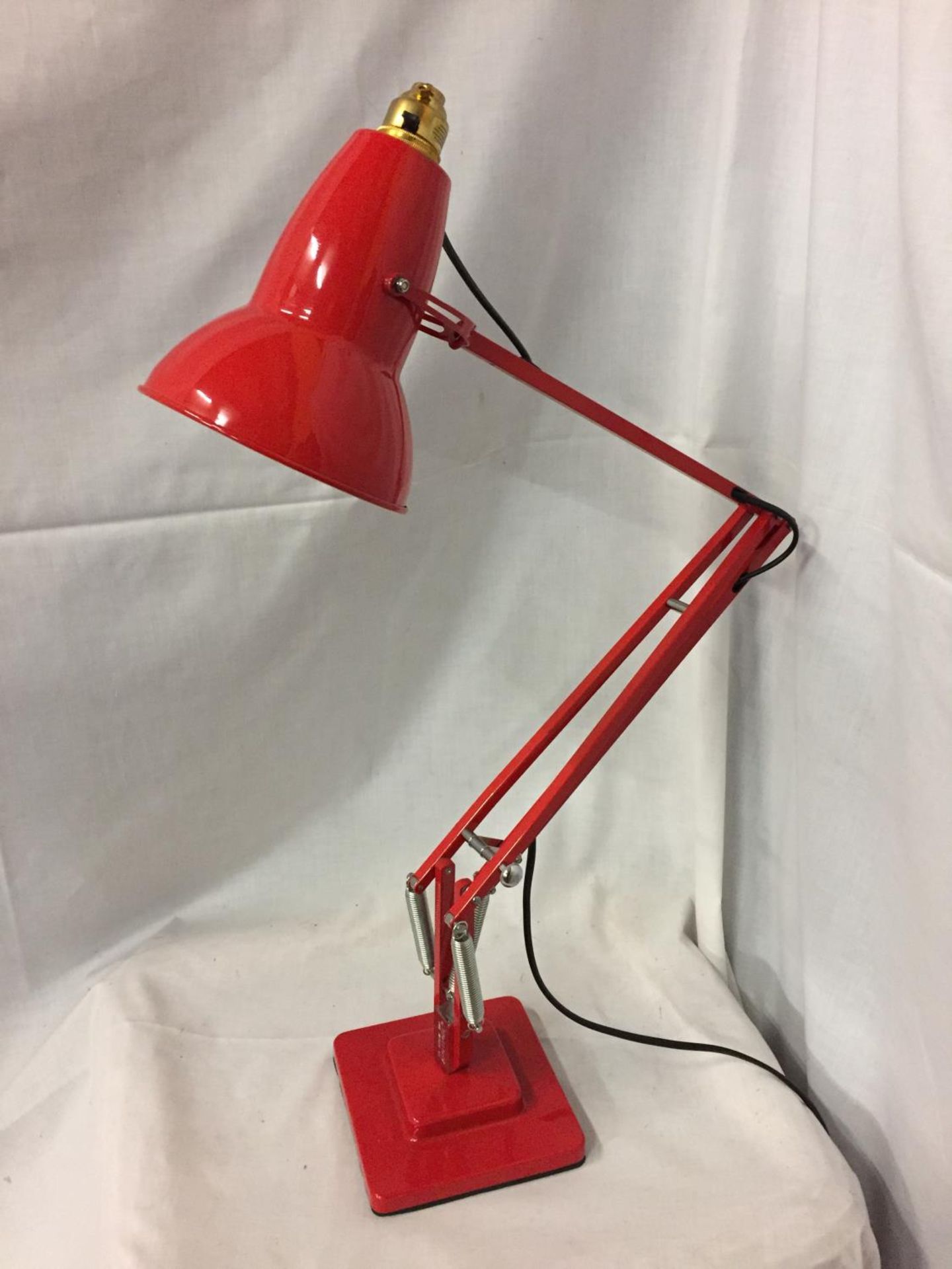 A RED ANGLE POISE LAMP