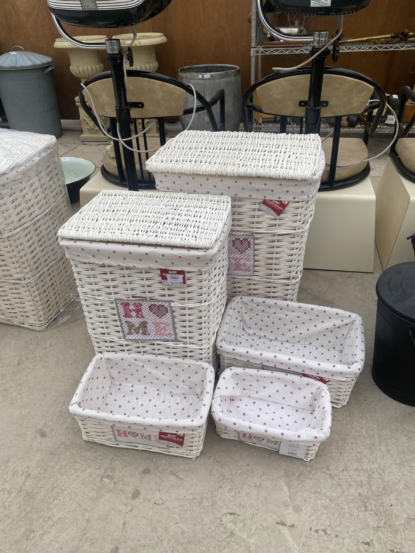 AN AS NEW SET OF FIVE GRADUTED WICKER STORAGE BASKETS AND CONTAINERS