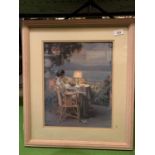A MOUNTED AND FRAMED PRINT OF A WOMAN DINING ALONE AT DUSK OVERLOOKING THE OCEAN