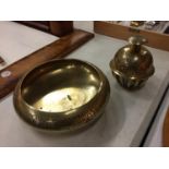 TWO ITEMS OF BRASSWARE TO INCLUDE A DECORATIVE BOWL AND A TIBETAN BELL