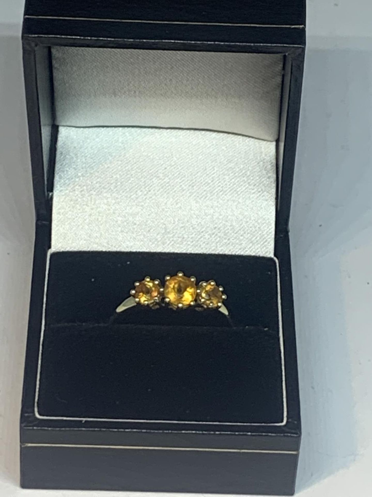 A 9 CARAT GOLD RING WITH THREE IN LINE CITRINES SIZE R IN A PRESENTATION BOX - Image 6 of 6