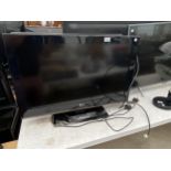 A 32" LG TELEVSION WITH REMOTE CONTROL