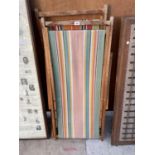 A PAIR OF VINTAGE WOODEN FOLDING DECK CHAIRS