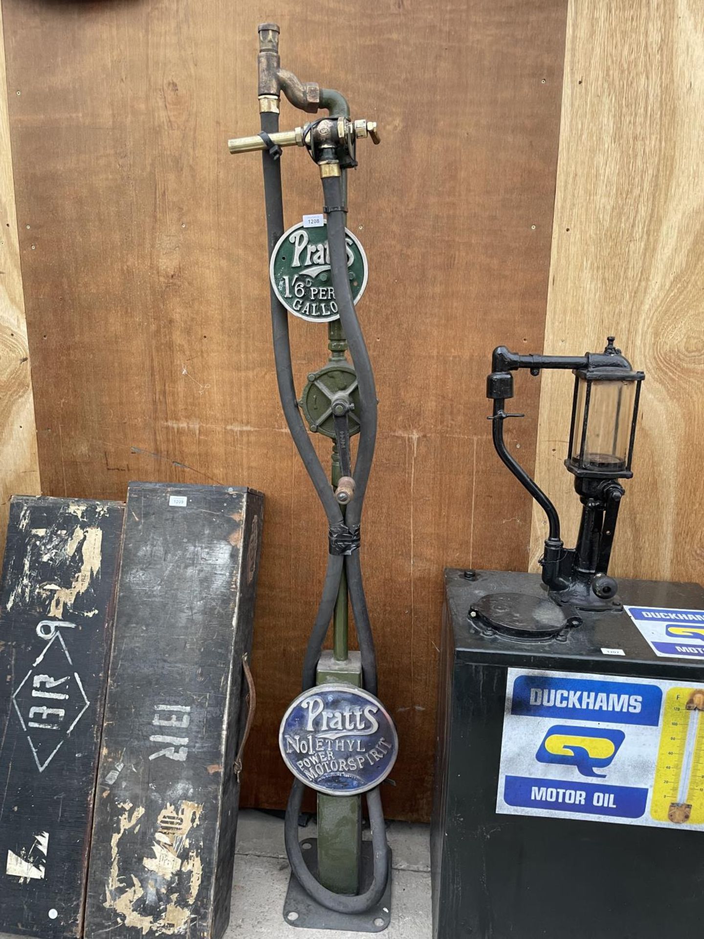 A PRATTS MANUAL PETROL PUMP WITH BRASS NOZZLE