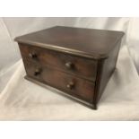 AN OAK TABLE TOP TWO DRAWER CHEST