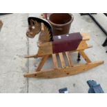 A VINTAGE WOODEN CHIULDRENS ROCKING HORSE