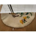 AN OVAL TAPESTRY RUG