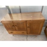 AN ELM ERCOL SIDEBOARD ENCLOSING THREE CUPBOARDS AND ONE DRAWER, 45" WIDE