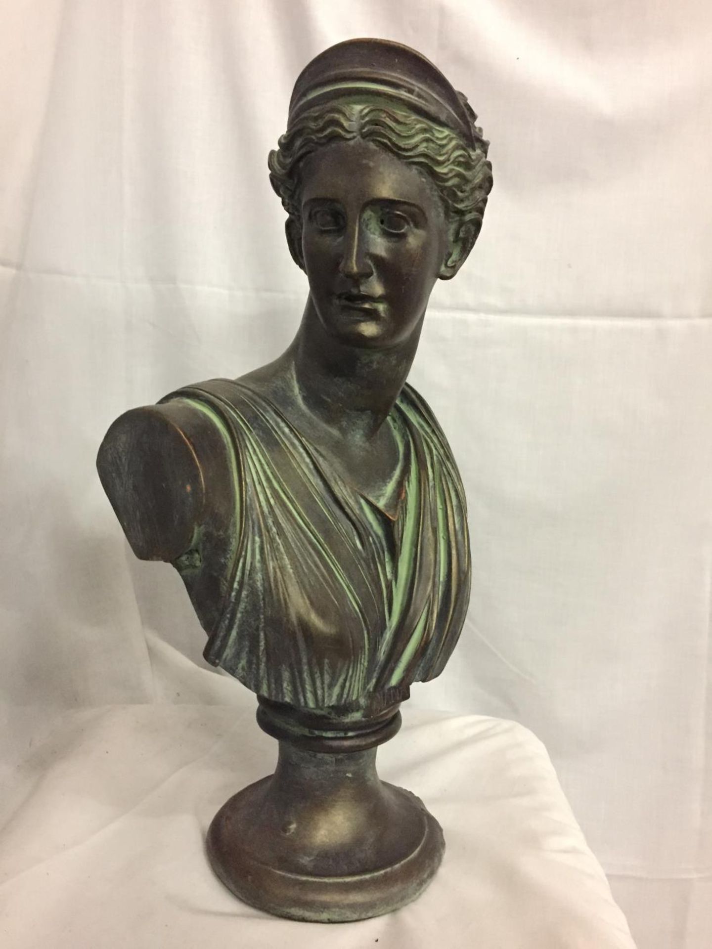 A BRONZE STONE BUST OF DIANA, HEIGHT APPROX 52CM, WIDTH AT WIDEST POINT - APPROX 30CM