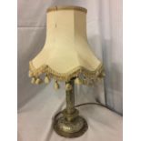 AN ORNATE WHITE METAL LAMP BASE