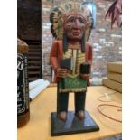 A WOODEN NORTH AMERICAN INDIAN STATUE