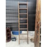 A VINTAGE EIGHT RUNG CLIMBING FRAME LADDER