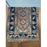 A LARGE DECORATIVE PATTERNED RUG