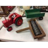 A WOODEN MODEL OF A FARM TRACTOR TOGETHER WITH ATTACHABLE TRAILER AND FIELD ROLLER