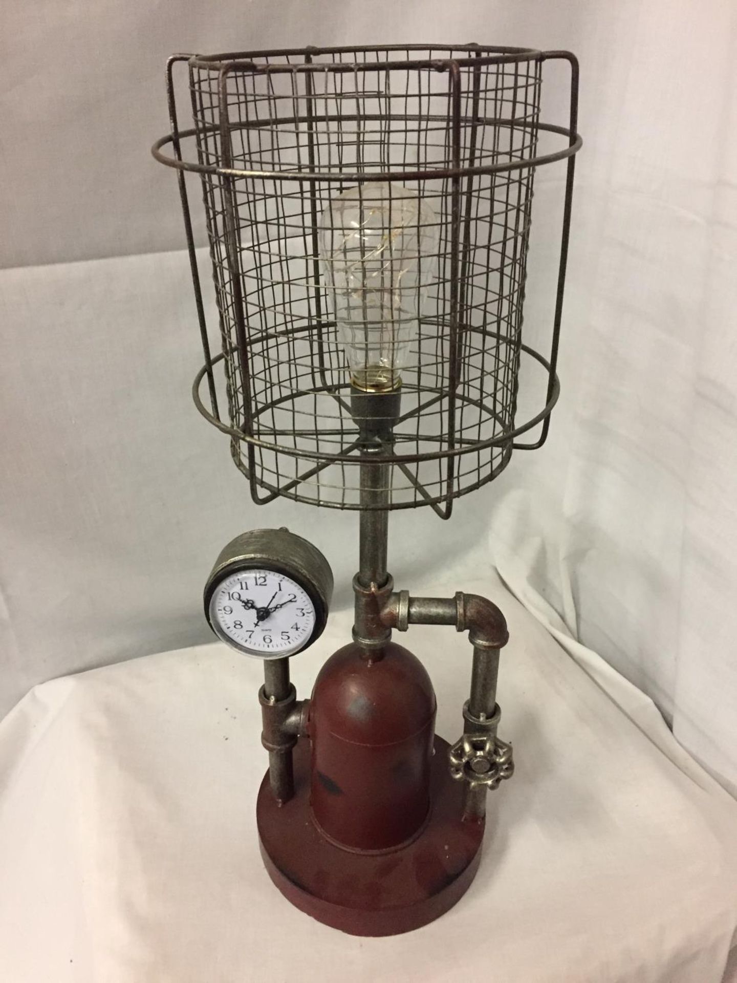 A STEAM PUNK STYLE DECORATIVE LAMP AND CLOCK