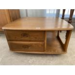 AN ELM ERCOL TWO TIER COFFEE TABLE ENCLOSING TWO DRAWERS, 31.5" SQUARE