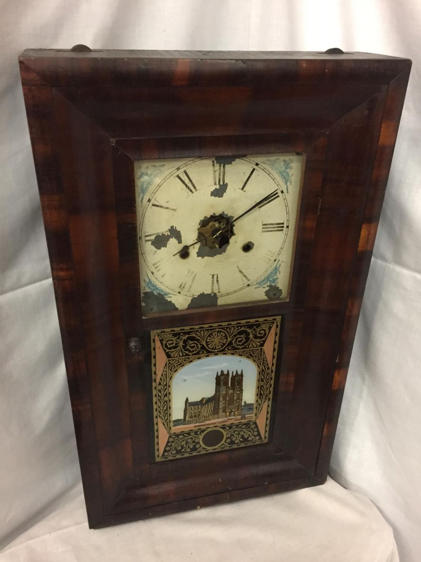 AN AMERICAN THIRTY HOUR WALL CLOCK BY JEROME AND CO IN WORKING ORDER BUT NO WARRANTY