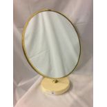 A RETRO CIRCULAR DRESSING TABLE MIRROR