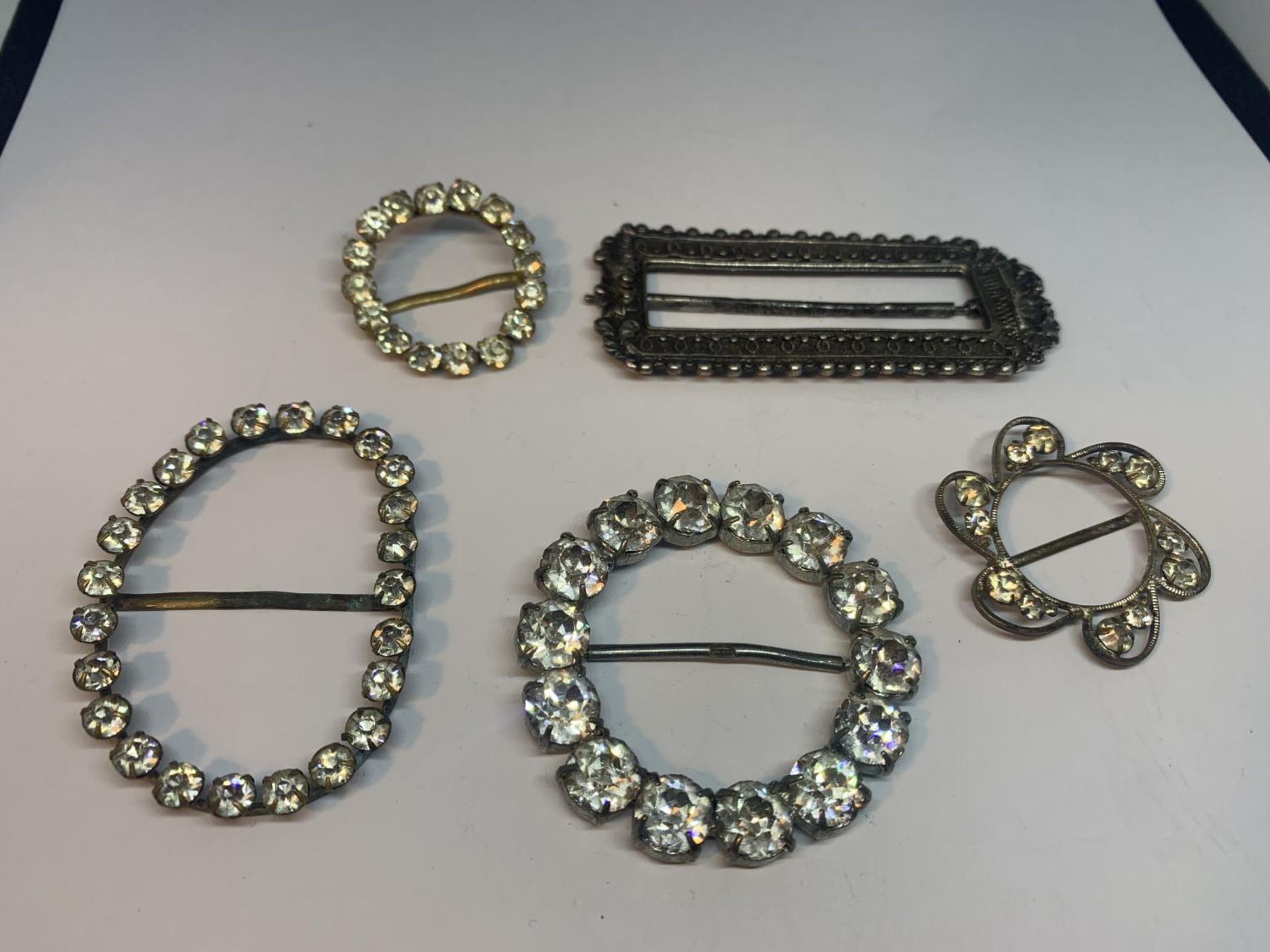 FIVE VICTORIAN ORNATE BUCKLES