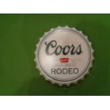 A METAL BOTTLE TOP SHAPED COORS BEER SIGN