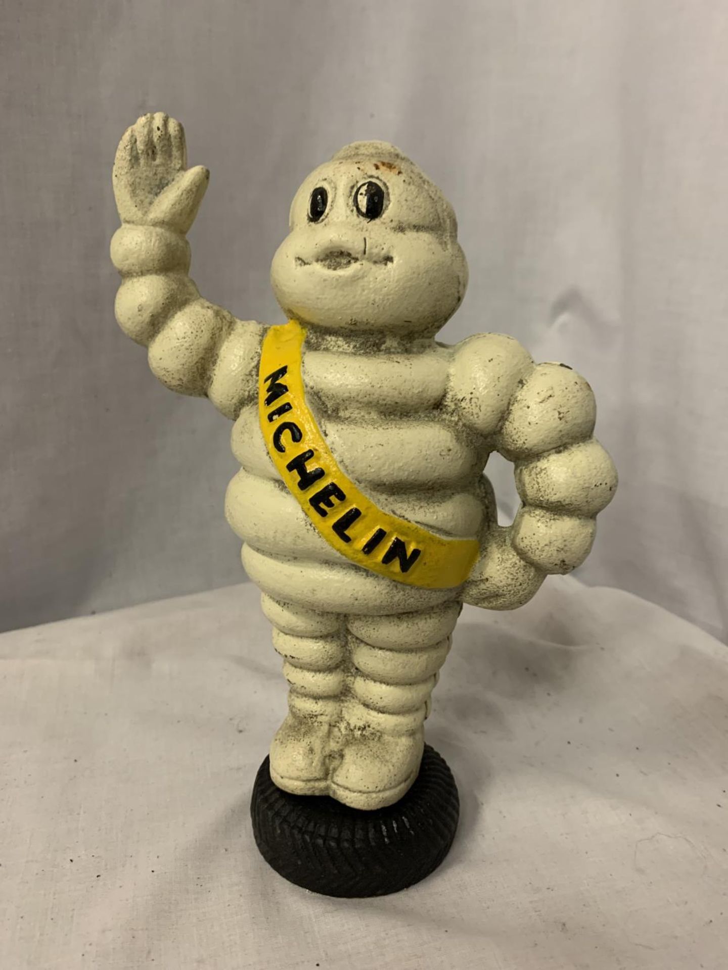 A CAST IRON MICHELIN MAN, HEIGHT 23.5CM