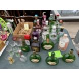 A LARGE ASSORTMENT OF EMPTY GIN BOTTLES, VINTAGE MATEUS ROSE BOTTLES AND VINTAGE WINE CORKS, IDEAL