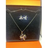 A DECORATIVE MARKED SILVER NECKLACE WITH CLEAR AND BLUE STONE FLOWER PENDANT AND A PAIR OF