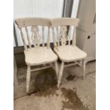 A PAIR OF PAINTED VICTORIAN KITCHEN CHAIRS