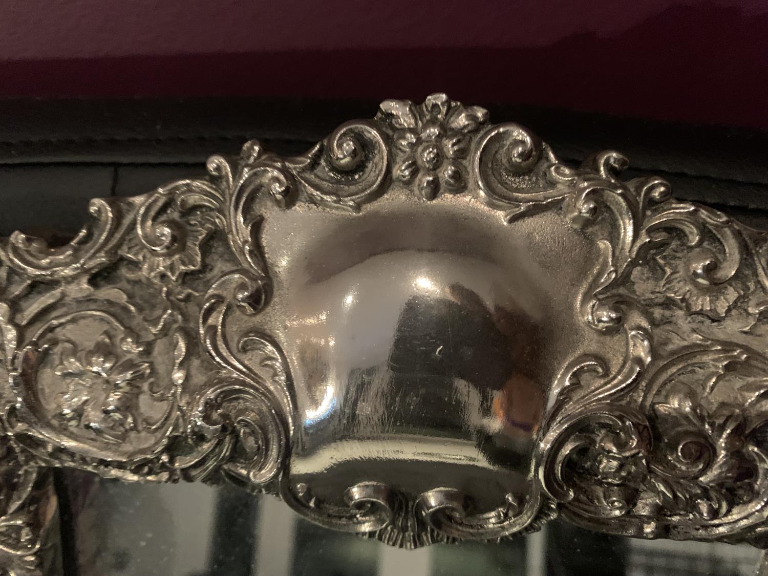 AN ORNATE SILVER FRAMED MIRROR WITH INDISTINCT HALLMARK 25CM X 39CM - Image 2 of 4