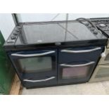 A BLACK NEW WORLD RANGE COOKER