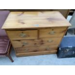 A 19TH CENTURY PINE CHEST OF TWO SHORT AND TWO LONG DRAWERS 35" WIDE