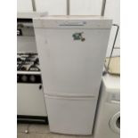 A WHITE CANDY UPRIGHT FRIDGE FREEZER