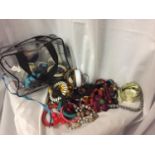 A BAG CONTAINING COSTUME JEWELLERY TO INCLUDE EARRINGS, BEADS, BANGLES, ETC