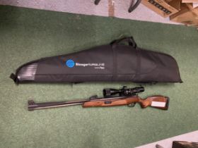 A STOEGER F40 .22 AIR RIFLE WITH STOEGER 3-9 X 40 LASER TELESCOPIC SIGHTS AND GUN SLEEVE