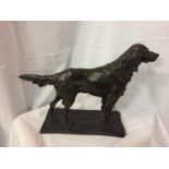 A BRONZE STYLE SCULPTURE OF A RETREIVER DOG. LENGTH 51CM, HEIGHT 35CM