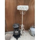 A WHITE PAINTED METAL PLANT STAND AND A VINTAGE VALOR HEATER