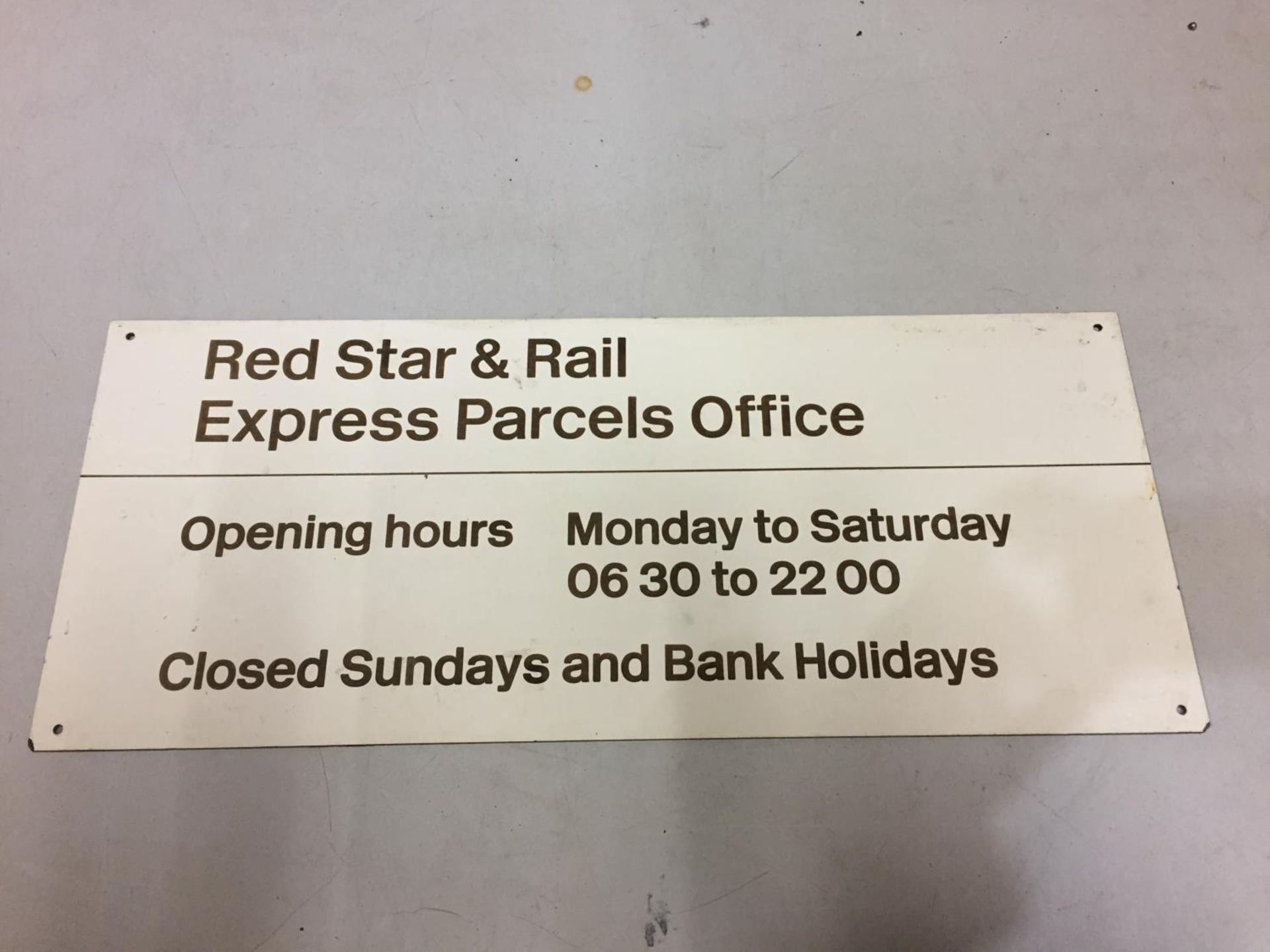 A RED STAR AND RAIL EXPRESS PARCELS OFFICE TIN SIGN