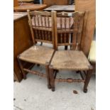 A PAIR OF LANCASHIRE SPINDLE BACK RUSH SEATED DINING CHAIRS