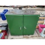 A METAL TWO DOOR STORAGE CUPBOARD WITH INNER SHELVES