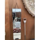 A LONG RECTANGULAR BEVELED EDGE WALL MIRROR