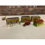 THREE BOXED MATCHBOX MODELS - GARAGE PUMPS AND SIGN A1, B TYPE BUS NO 2 AND METAL LOCK UP GARAGE A3