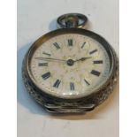 A CONTINENTAL ANTIQUE MARKED 935 LADIES POCKET WATCH WITH A GILT DESIGN FLORAL FACE