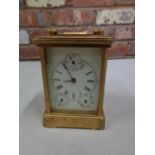 A VINTAGE CARRIAGE CLOCK WITH DECORATIVE SIDE PANELS DEPICTING LADY AND GENTLEMAN