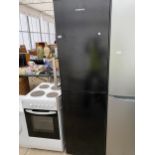 A BLACK HOOVER UPRIGHT FRIDGE FREEZER